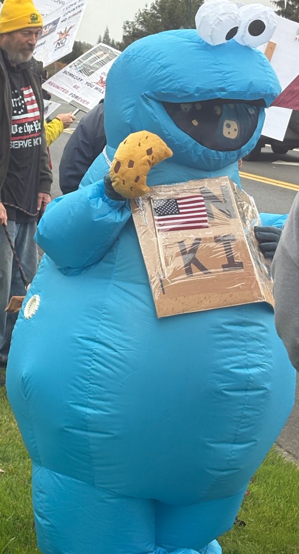 Blow up Cookie Monster with No Kings sign